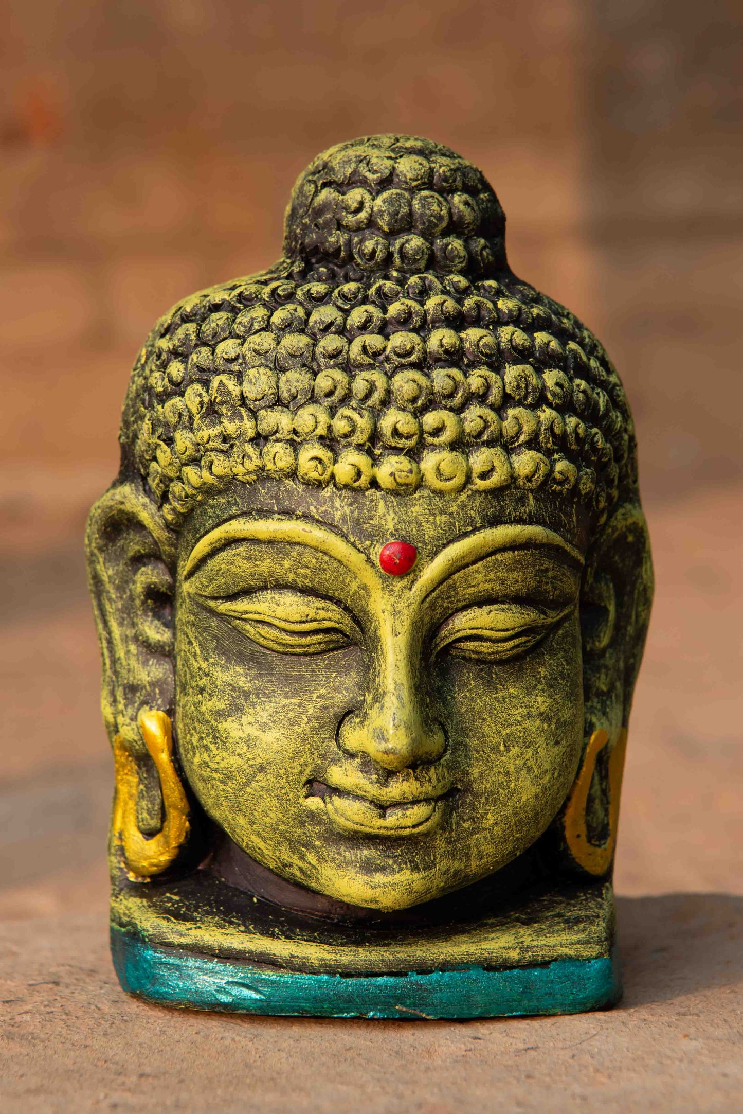 Terracotta Buddha Face Sculpture
